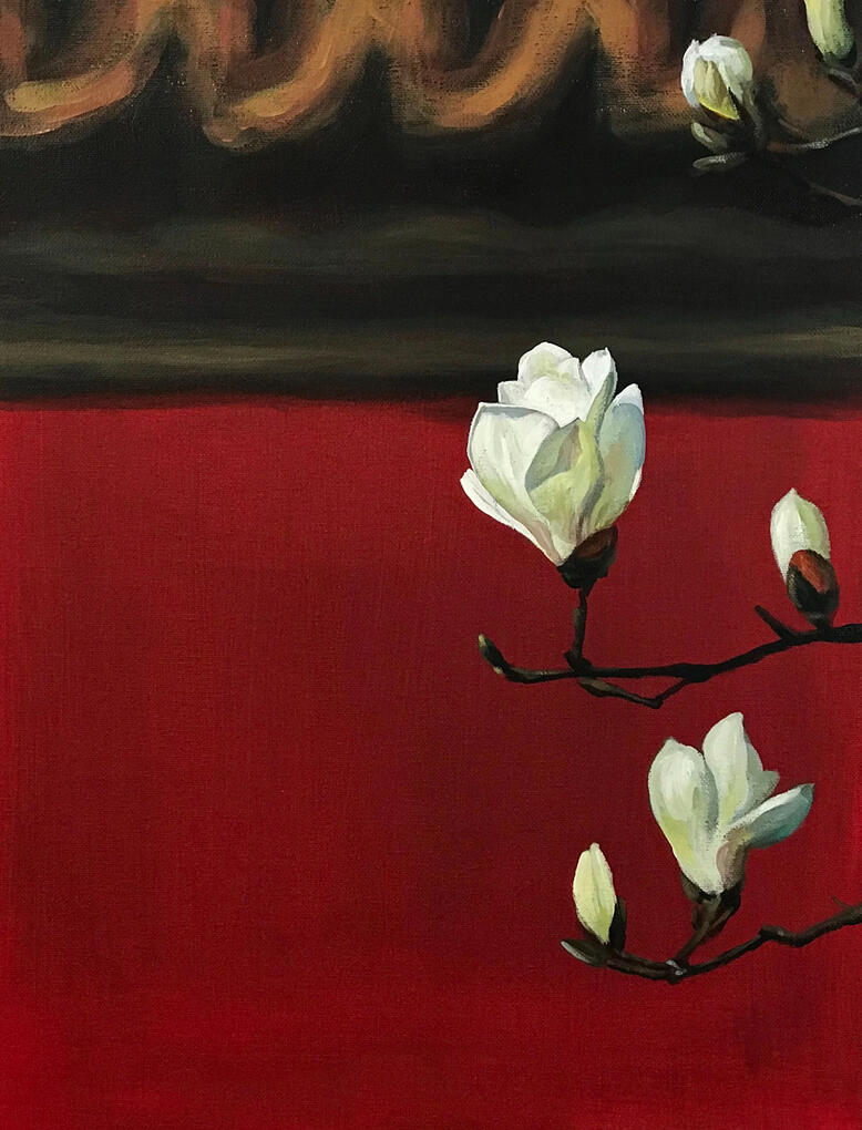 Magnolia blossoms against the red walls